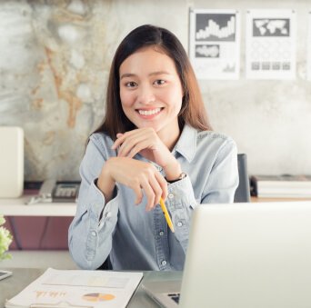 girl sitting in front of a laptop